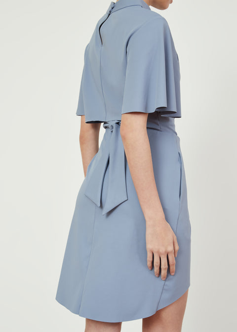 Back view of ACOT Laser Motif Short Skirt in Powder Blue with Pocket by As Intended a Workleisure label