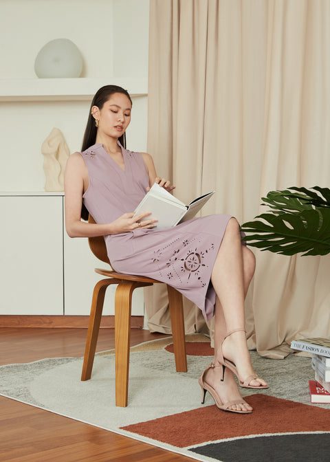 Sitting and reading a book in CELO Dress in Lilac by As Intended a Workleisure label