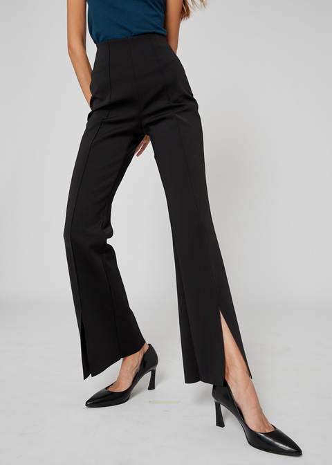 Slim fit with a flared leg, accentuated by a front-pleat detail and front slit, creating an elongating effect for the legs