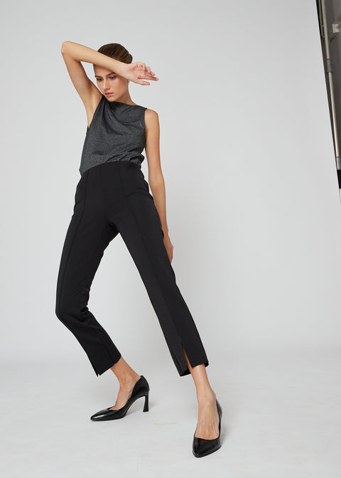 Slim fit with a front-pleat detail and front slit creating an elongating effect for the legs
